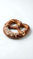 Freshly baked pretzel with coarse salt crystals and raisins, isolated on white background. Perfect for bakery, food, and culinary design projects.