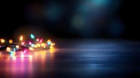 Colorful string lights creating warm bokeh glow on reflective surface with blurred background for holiday decorations and festive atmosphere design.