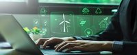 Businessman working on laptop with green energy sustainability icons overlay showing renewable power, eco technology and environmental solutions for corporate planning.