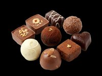 Assorted chocolate candies and truffles isolated on transparent background, ready for confectionery designs, packaging, menus, and print-on-demand products.