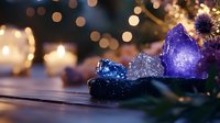 Glowing purple and blue crystals with burning candles create magical atmosphere against blurred bokeh lights background, mystical holiday setting.
