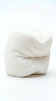 White fluffy towel folded neatly on clean background for spa bathroom hotel hospitality hygiene comfort relaxation wellness luxury home decor.