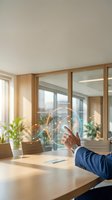 Businessman in navy suit interacting with holographic digital interface displaying interconnected nodes and business metrics in modern office with wooden furniture and natural light.