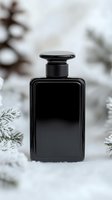Elegant black perfume bottle on snowy winter background with pine branches, luxury fragrance mockup for cosmetic product advertising and branding.
