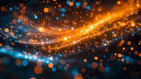 Magical orange and blue bokeh lights with glowing particles creating dynamic motion trails against dark background. Abstract cosmic energy flow effect.