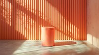 Minimalist coral-colored cylindrical pedestal on matching wall with dramatic diagonal shadow lines created by sunlight, modern abstract architectural interior.