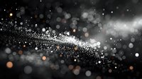 Magical glowing particles and bokeh lights creating dynamic wave pattern on black background. Abstract festive motion blur effect for holiday designs.