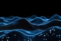 Futuristic digital wave landscape with glowing blue particles and flowing lines creating abstract terrain against dark background. Technology concept.