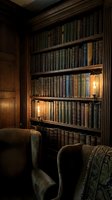 Vintage library interior with antique leather-bound books on wooden shelves, warm candlelight illuminating cozy reading chairs in classic study room atmosphere.