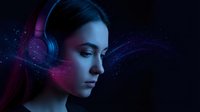 Young woman with headphones in futuristic neon lighting with digital particles and cosmic atmosphere for music technology and entertainment concepts.