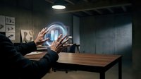 Businessman hands reaching toward glowing holographic sphere in modern office workspace representing future technology and digital innovation concepts.