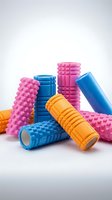 Colorful foam rollers for muscle recovery and fitness training isolated on white background for sports and wellness design projects.
