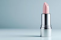 Pink lipstick in silver tube on clean background for cosmetics and beauty product advertising campaigns.