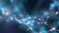 Glowing neural network connections on dark blue background with bokeh light effects and bright synaptic nodes forming abstract technological pattern.