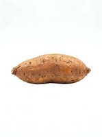 Single sweet potato isolated on white background, ready for culinary, nutritional, and food packaging design use.