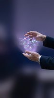Businessman holding glowing digital holographic cube with neon purple light effects, representing technology innovation, data management, and future business solutions.