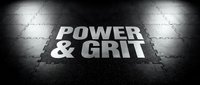 Power and grit text on dark concrete floor with dramatic lighting. Motivational typography for fitness, sports, and determination themes.