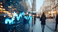 Digital financial data display on glass surface with blurred urban street scene and silhouette of woman walking in background.