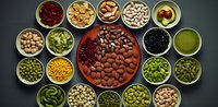 Variety of healthy nuts, seeds, legumes and superfoods in ceramic bowls arranged in circle pattern on dark background. Fresh nutritious ingredients.