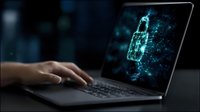 Digital security concept with glowing blue padlock made of binary code and circuit patterns on laptop screen while person types on keyboard in dark room.