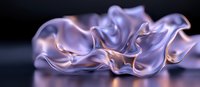 Ethereal flowing fabric in soft purple and rose gold tones creates elegant waves and folds against dark background, showcasing luxurious textile movement and light play.
