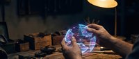 Man examining futuristic holographic brain model with neural networks in dimly lit workshop environment for medical technology and neuroscience research applications.