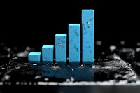 Blue ascending bar graph on dark textured surface with water drops, showing business growth and progress concept in dramatic lighting and selective focus.