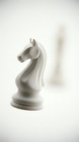 White chess knight piece isolated on neutral background, ready for design projects, game graphics, strategy concepts, and marketing materials.