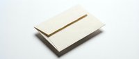 Blank cream envelope and folded letter on white surface for stationery mockup and business correspondence design projects.