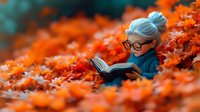 Charming miniature doll with gray hair and glasses reading book while sitting among vibrant orange autumn leaves in cozy blue sweater. Perfect for fall season stories.