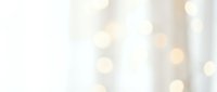 Soft golden bokeh lights on cream background creating dreamy atmosphere for wedding invitations, holiday cards, luxury branding and elegant design projects.