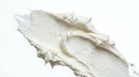 Creamy white cosmetic or skincare product texture swatch isolated on white background, suitable for beauty packaging and product mockups.