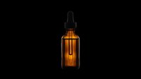 Amber glass dropper bottle with black pipette cap isolated on transparent background, ready for cosmetics, essential oils, serums, and wellness product designs for packaging, labels, and print-on-demand applications.