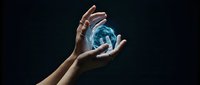 Hands holding glowing blue energy sphere with magical light effects on dark background for fantasy and supernatural concepts.