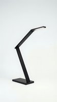 Modern black adjustable desk lamp with angular articulated arm and LED light head on rectangular base, isolated on white background for design and product use.
