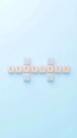 Approved word spelled with wooden letter blocks arranged in crossword style on soft blue background, isolated design element for business and approval concepts.