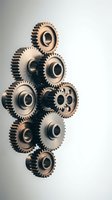 Mechanical gears arrangement on white background showcasing industrial engineering components and precision machinery parts for technical design.