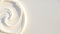Creamy white swirl texture with smooth flowing curves creating elegant spiral pattern on soft beige background for luxury cosmetic and skincare designs.