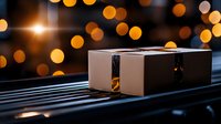 Package delivery on car dashboard with warm bokeh lights creating cozy evening atmosphere for shipping and logistics concepts.