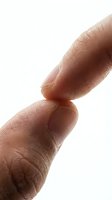 Two human fingers touching at the tips, close-up macro shot showing skin texture and fingerprints on white background.