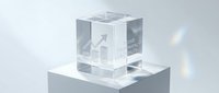 Growth arrow symbol etched in transparent crystal cube on white pedestal, representing business success, financial progress, and upward momentum for corporate presentations.