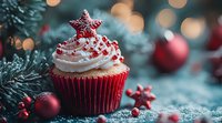 Festive red velvet cupcake with white frosting and star sprinkles, decorated with cranberries against blurred Christmas tree background with red ornaments.