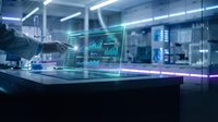 Futuristic workspace with holographic data visualization and analytics displays floating above glass desk in modern tech office environment.
