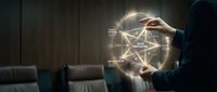 Businesswoman holding glowing network diagram with interconnected nodes and data flow visualization in modern office environment for digital transformation concepts.