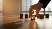 Business hand selecting green checkmark cube from row of red X blocks on wooden desk representing quality choice and decision making process.