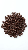 Fresh roasted coffee beans arranged in circular pile on white background, isolated for cafe menu design and beverage marketing materials.