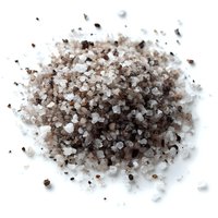 Close-up of mixed salt and pepper seasoning on white background, showing coarse crystals and black peppercorns for gourmet cooking.