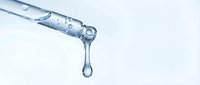 Clear liquid dropper dispensing a single drop against white background, isolated for medical, pharmaceutical, skincare and laboratory design applications.