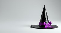 Black witch hat with purple bow ribbon on white background, isolated party costume accessory for Halloween celebrations and themed events.