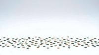 Abstract scattered dots pattern in earth tones creating flowing wave design on light background for modern graphic projects and branding materials.